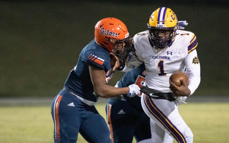 Columbia quarterback Tyler Jefferson tries to escape pressure from Escambia during the Region 1-3S semifinals on Nov. 18. (GREGG PACHKOWSKI/Pensacola News Journal)