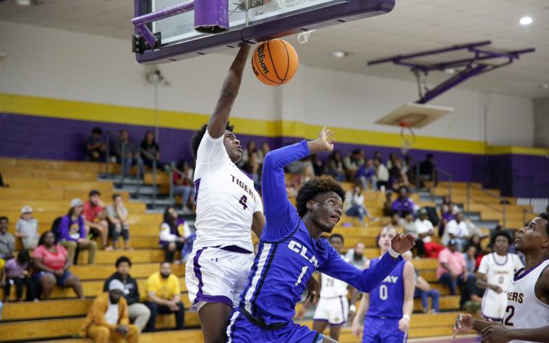 Columbia forward Ty’jahn Wright dunks on Clay wingman J’den Golding on Wednesday night. (BRENT KUYKENDALL/Lake City Reporter)