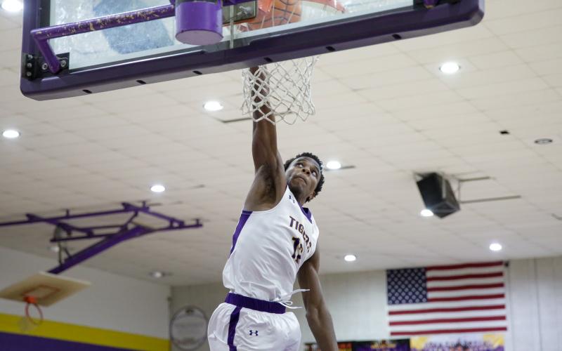 Columbia forward Seth Stockton dunks against Clay on Dec. 7. (BRENT KUYKENDALL/Lake City Reporter)