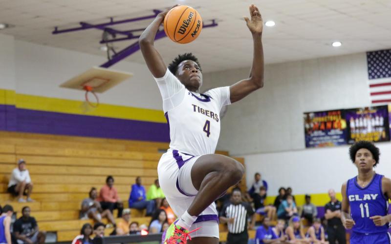 Columbia forward Ty'jahn Wright goes up for a dunk against Clay on Dec. 7. (BRENT KUYKENDALL/Lake City Reporter)