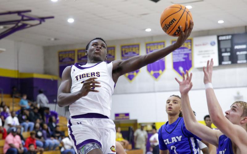 Columbia guard Isaac Broxey goes up for a layup against Clay on Dec. 7. (BRENT KUYKENDALL/Lake City Reporter)