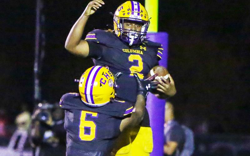 Columbia running back Tony Fulton (2) celebrates with receiver Tray Tolliver (6) after scoring a touchdown against Choctawhatchee in the Region 1-3S final last Friday. (BRENT KUYKENDALL/Lake City Reporter)