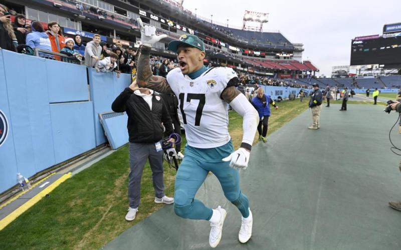 Jacksonville Jaguars tight end Evan Engram celebrates as he runs off the field a following 36-22 victory over the Tennessee Titans on Sunday in Nashville, Tenn. (MARK ZALESKI/Associated Press)