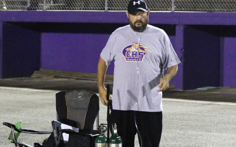 Columbia head coach Chip Garner stands on the sideline with his oxygen tank during Tuesday’s game against Hamilton County. (MORGAN MCMULLEN/Lake City Reporter)