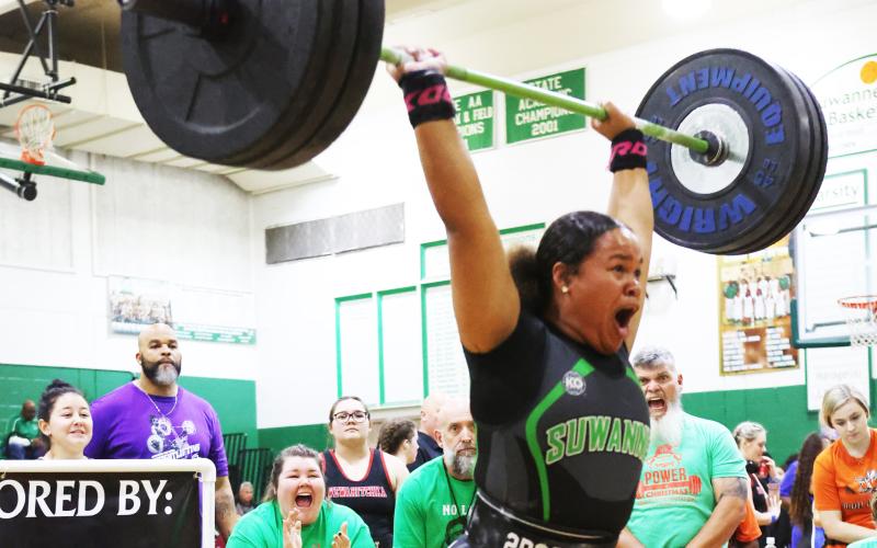 Suwannee’s Kaly Cuffy finishes her clean and jerk during the Power of Christmas meet on Friday. (PAUL BUCHANAN/Special to the Reporter)