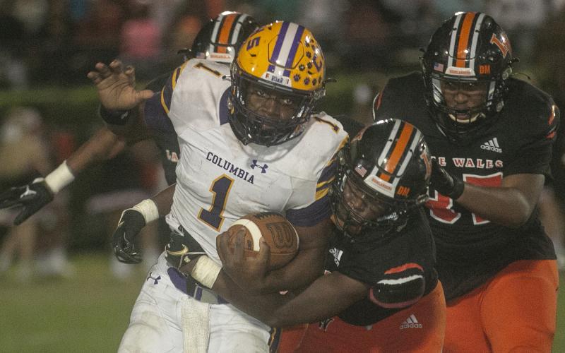 Columbia quarterback Tyler Jefferson takes a carry up the field against Lake Wales during Friday’s Class 3S state semifinal. (MICHAEL WILSON/Special to the Reporter)