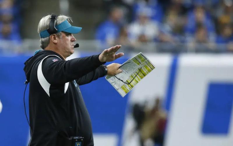 Jacksonville Jaguars head coach Doug Pederson signals from the sideline during Sunday’s against the Detroit Lions in Detroit. (DUANE BURLESON/Associated Press)