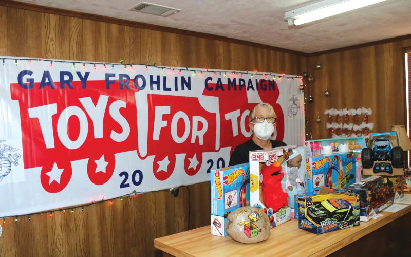 Toys for Tots Coordinator Inga Dwyer sorts through donated toys back in 2020. After giving out toys last week for Christmas, the organization is looking for a new location to provide services. (FILE)