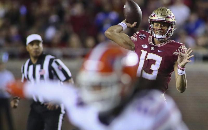 Florida State quarterback Jordan Travis throws a pass against Florida on Nov. 25 in Tallahassee. (PHIL SEARS/Associated Press)