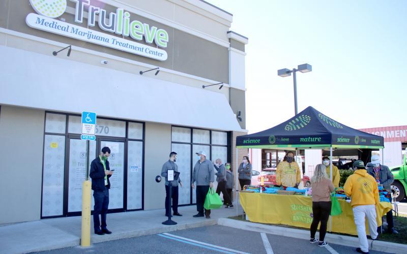 Customers and employees gather outside Trulieve’s Lake City location at its grand opening on Nov. 18, 2020. (FILE)