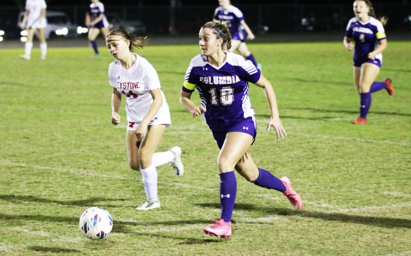 Columbia midfielder Skyler Ziegaus pushes the ball up the field against Keystone Heights on Monday night. (JORDAN KROEGER/Lake City Reporter)