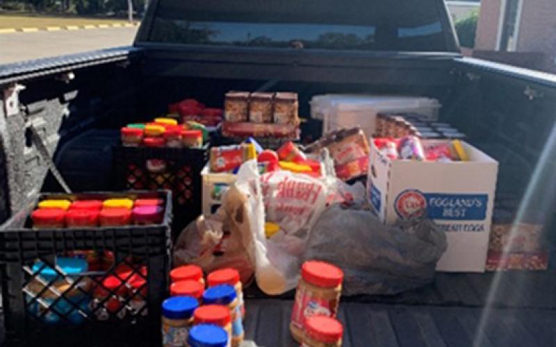 Peanut butter collected in Lafayette County is delivered to a local food bank for school backpack programs and needy families. (COURTESY)