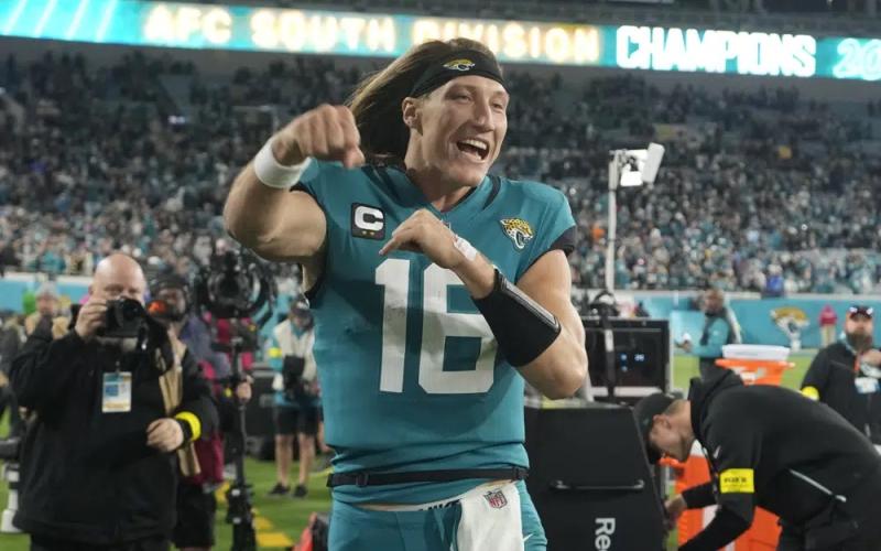 Jacksonville Jaguars quarterback Trevor Lawrence celebrates after defeating the Tennessee Titans on Saturday in Jacksonville. The Jaguars won 20-16. (JOHN RAOUX/Associated Press)