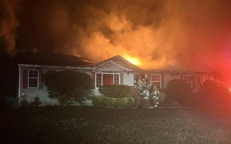 Suwannee County firefighters battle a house fire Sunday morning in western Suwannee County. Nobody was injured in the fire. (COURTESY SUWANNEE COUNTY FIRE RESCUE)