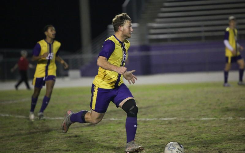 Columbia's Mickey Johnson dribbles the ball up the field against Palatka on Jan. 17. (BRENT KUYKENDALL/Lake City Reporter)