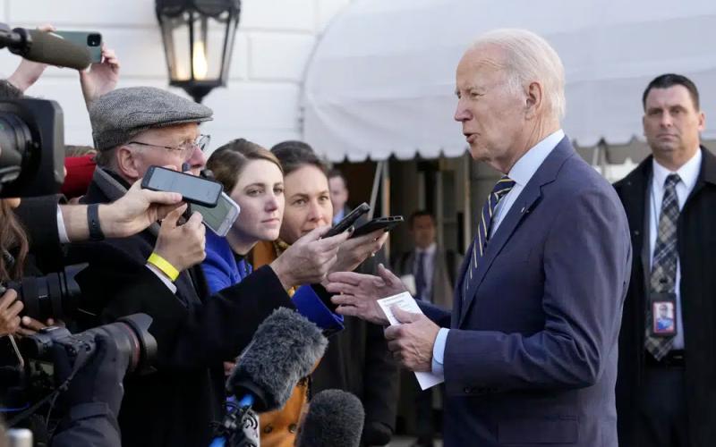 President Joe Biden talks with reporters before he and first lady Jill Biden board Marine One on the South Lawn of the White House on Wednesday. (SUSAN WALSH/Associated Press)