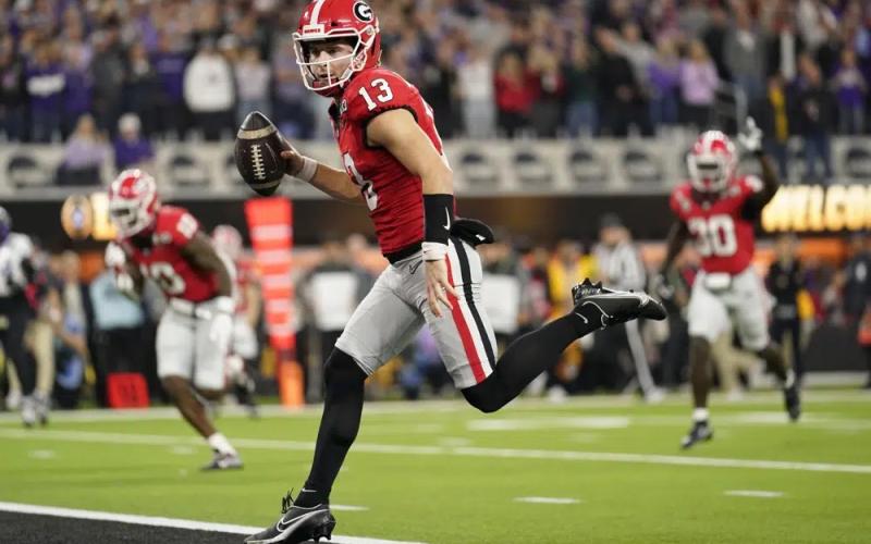 Georgia quarterback Stetson Bennett runs into the end zone for a touchdown against TCU the national championship on Monday in Inglewood, Calif. (ASHLEY LANDIS/Associated Press)