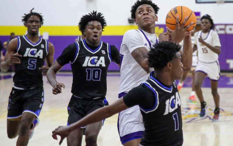 Columbia guard Jerome Carter drives to the basket against Impact Christian Academy on Jan. 19. (BRENT KUYKENDALL/Lake City Reporter)