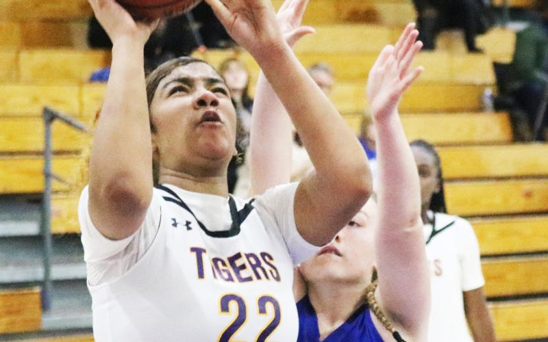 Columbia center Khalea Clark shoots while defended by Ridgeview guard Paetyn Miller on Jan. 23. (JORDAN KROEGER/Lake City Reporter)