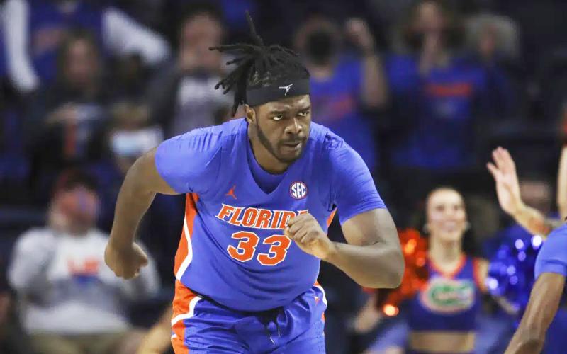 Florida center Jason Jitoboh runs up court after making a shot against Alabama on Jan. 5, 2022, in Gainesville. (MATT STAMEY/Associated Press)