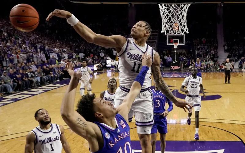 Kansas State forward Keyontae Johnson blocks a shot by Kansas forward Jalen Wilson on Jan. 17 in Manhattan, Kan. (CHARLIE RIEDEL/Associated Press)