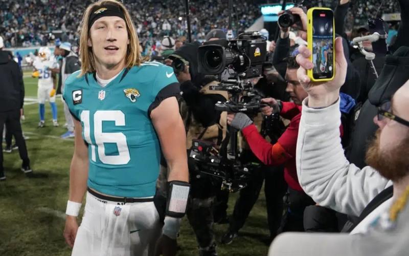 Jacksonville Jaguars quarterback Trevor Lawrence walks off the field after Saturday's wild-card playoff game against the Los Angeles Chargers in Jacksonville. The Jaguars won 31-30. (CHRIS CARLSON/Associated Press)
