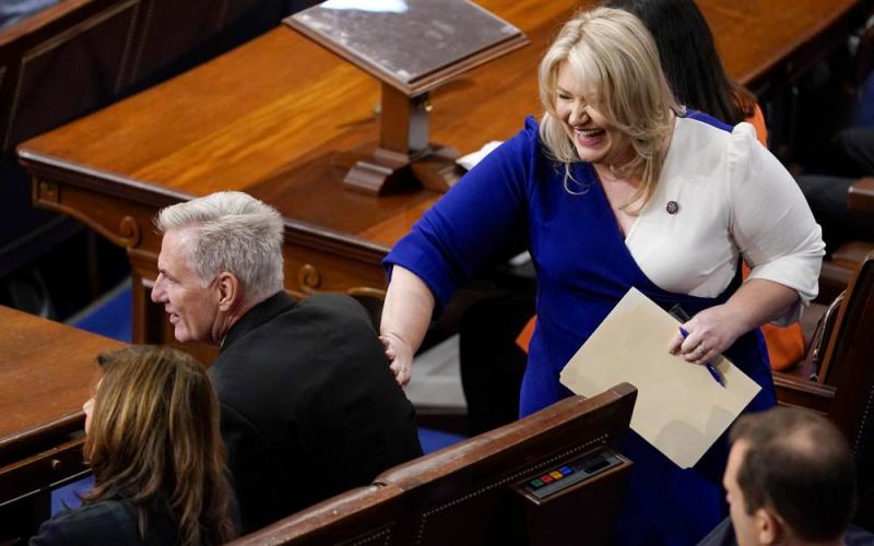 Rep. Kat Cammack, R-Fla., pats Rep. Kevin McCarthy, R-Calif., on the back after she nominated him as speaker for the sixth round of voting in the House chamber as the House meets for a second day to elect a speaker and convene the 118th Congress in Washington on Wednesday. (ANDREW HARNIK/Associated Press)