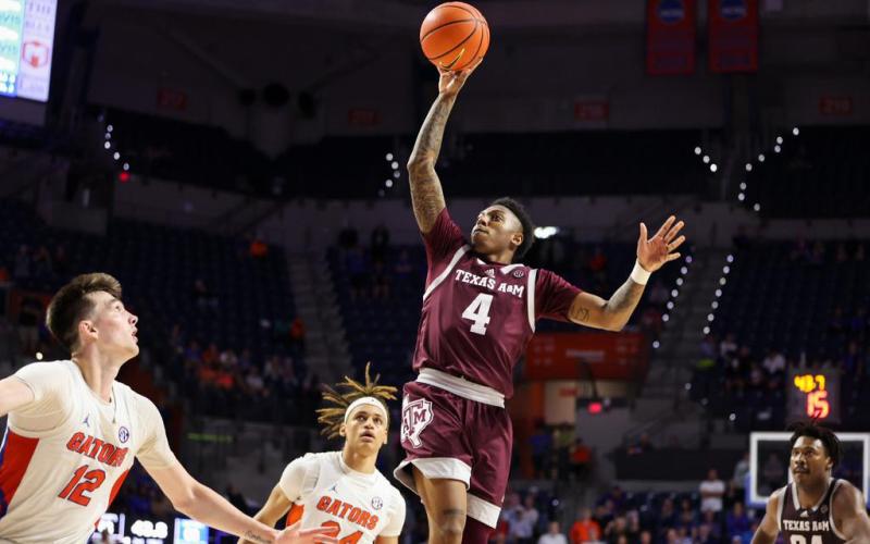Texas A&amp;M guard Wade Taylor IV makes a floater against Florida in the final minute of Wednesday's game in Gainesville. (COURTESY OF TEXAS A&amp;M ATHLETICS)