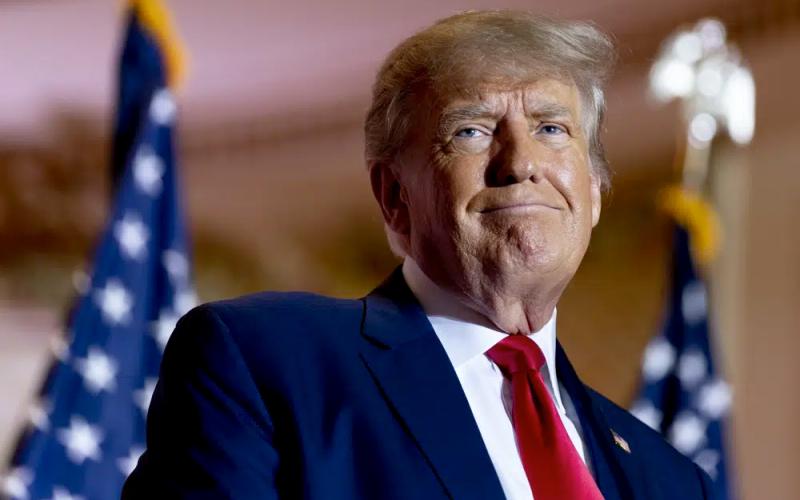 Former President Donald Trump announces he is running for president for the third time as he smiles while speaking at Mar-a-Lago on Nov. 15, 2022. (ANDREW HARNIK/Associated Press)
