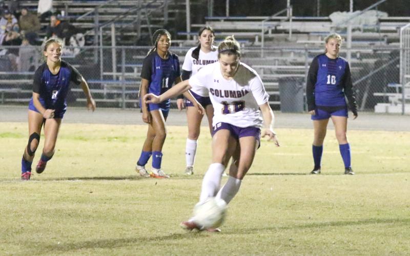 Columbia’s Skyler Ziegaus strikes the ball on her penalty kick in the first half of Friday’s District 2-5A semifinal at Clay. (MORGAN MCMULLEN/Lake City Reporter)