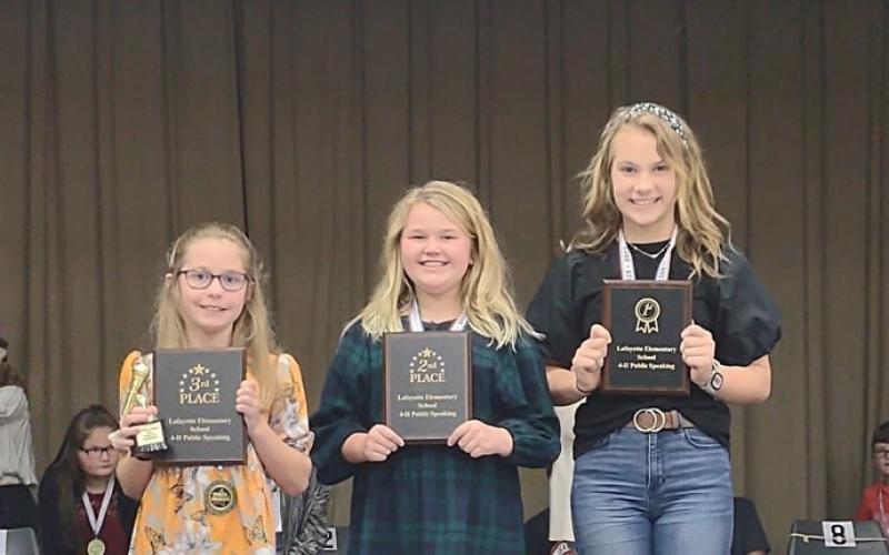 Whitney Mosley (right) won the Lafayette County 4-H Florida Power and Light Speech Contest. Placing second was Bristol Land (center) with Lane Colson (left) finishing third. (COURTESY)