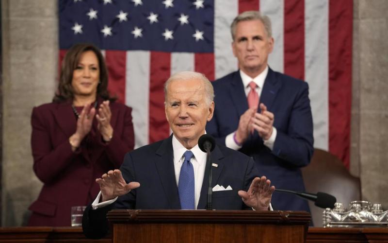 President Joe Biden delivers the State of the Union address to a joint session of Congress at the U.S. Capitol on Tuesday in Washington, as Vice President Kamala Harris and House Speaker Kevin McCarthy of Calif., applaud. (JACQUELYN MARTIN/AP Pool)