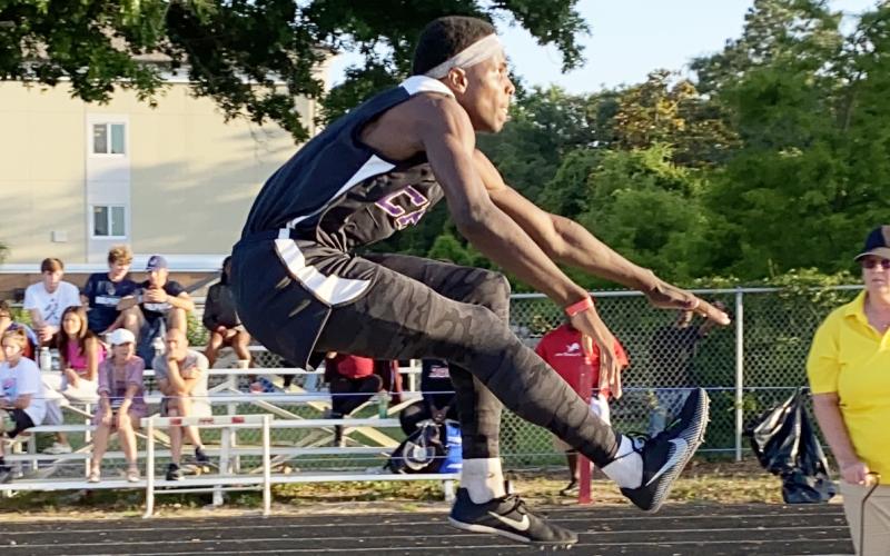 Columbia’s Seth Stockton competes in the triple jump last season. (FILE)