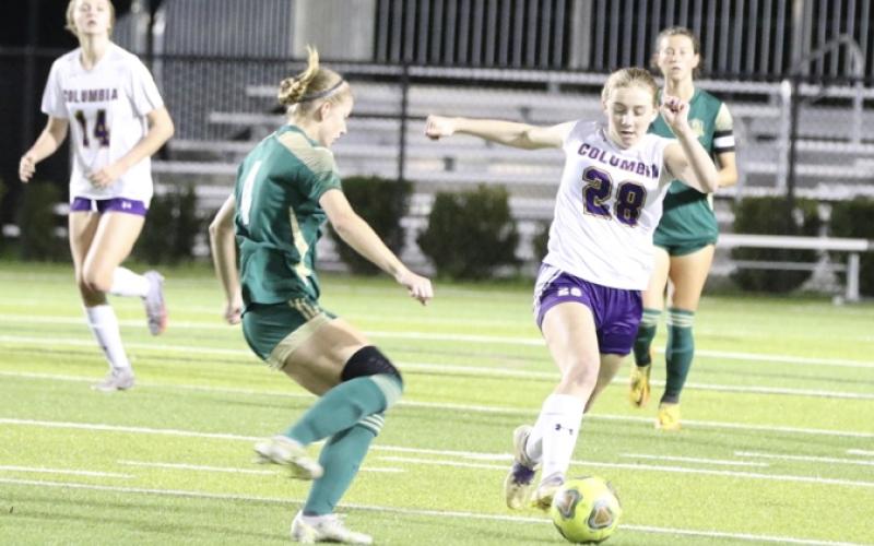 Columbia’s Kyndall Norris dribbles past Lincoln’s Izzy Young during Wednesday’s District 2-5A championship in Tallahassee. (MORGAN MCMULLEN/Lake City Reporter)