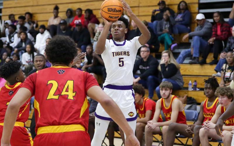 Columbia guard Jerome Carter shoots against Baker County on Friday night. (BRENT KUYKENDALL/Lake City Reporter)