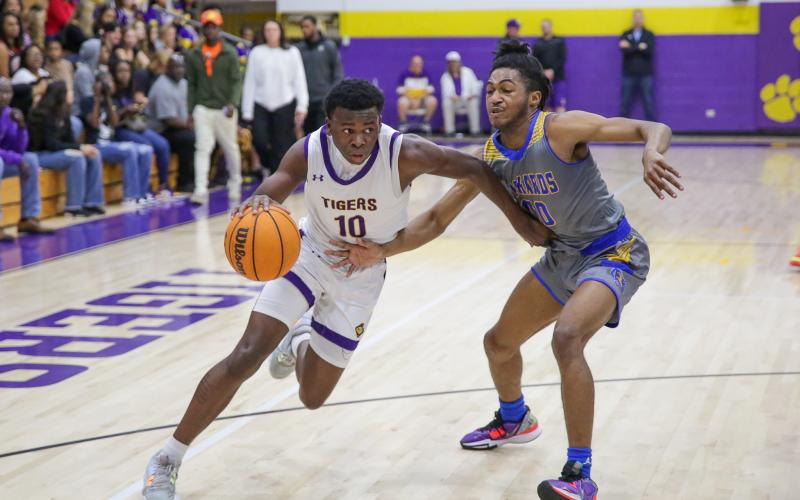 Columbia guard Isaac Broxey drives to the basket against Rickards during the District 2-5A championship on Friday. (BRENT KUYKENDALL/Lake City Reporter)