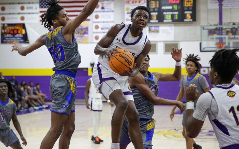 Columbia guard Isaac Broxey flies to the basket for a shot against Rickards during the District 2-5A championship last Friday. (BRENT KUYKENDALL/Lake City Reporter)