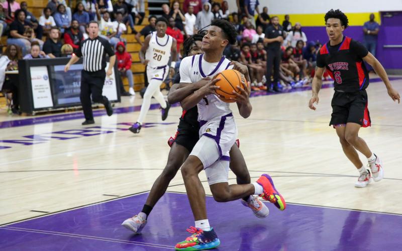 Columbia guard Jerome Carter is fouled in transition by Pine Forest during Thursday’s Region 1-5A quarterfinal. (BRENT KUYKENDALL/Lake City Reporter)