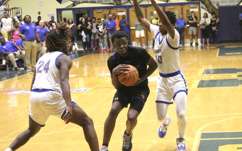 Columbia guard Isaac Broxey drives to the basket while defended by Mainland guard Jerel Moore (10) during Friday’s Region 1-5A final. (JORDAN KROEGER/Lake City Reporter)