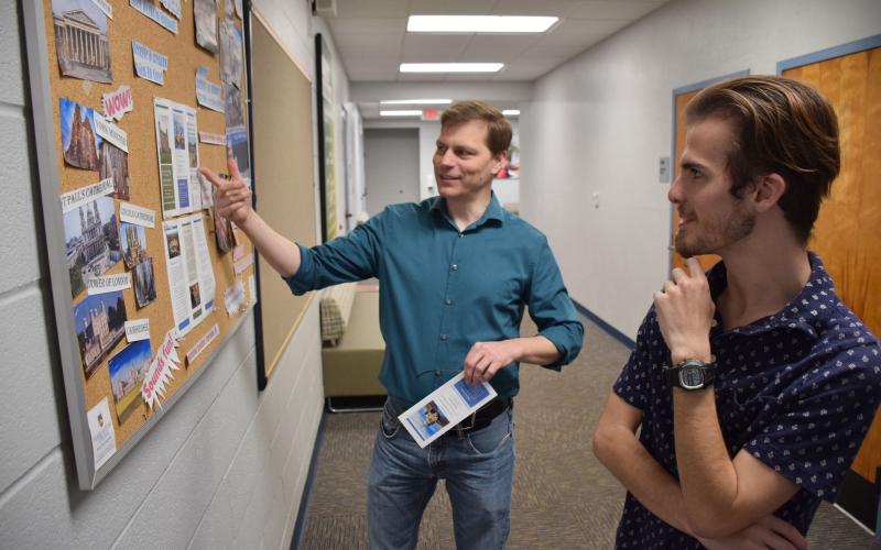 Florida Gateway College student Cade Mesnard (right) and FGC instructor Michael Baker discuss the college’s Study Abroad Program, which will take place in the United Kingdom. (COURTESY)