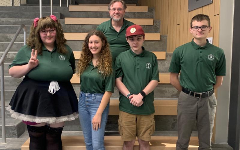 The Florida Gateway College Brain Bowl team is competing in the National Academic Quiz Tournaments Community College Championship Tournament in Chicago this weekend. Team members are Keilley Sweat (from left), Angelina Troshyna, Coach James Givvines, Hunter Neeley and Avery Murphy. Not pictured is Lindsay Wheeles. (COURTESY)