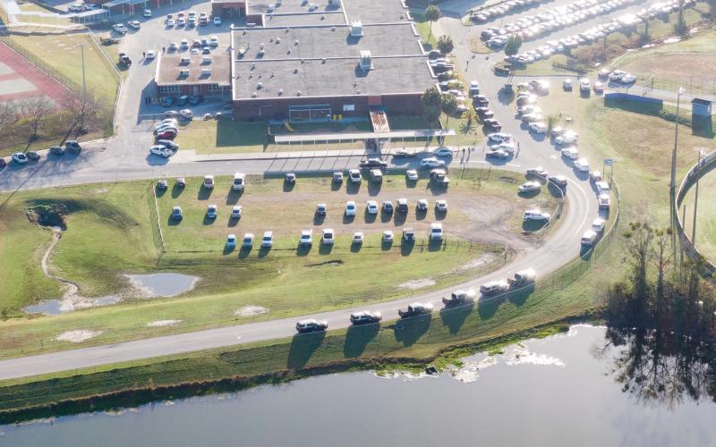 Law enforcement vehicles line the road into Columbia High School on Thursday morning after a call of an armed person on campus. The armed person turned out to be a JROTC cadet bringing back a non-functioning training rifle. (RAY CARPENTER/Special to the Reporter)