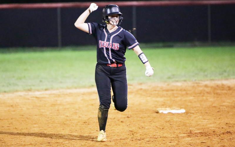 Fort White pitcher Kadence Compton celebrates on her way to third base after hitting a home run against Union County during last season’s Region 3-1A championship. (BRENT KUYKENDALL/Lake City Reporter)