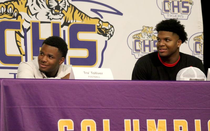 Columbia receiver Tra' Tolliver (left) signed his letter of intent with Iowa Central Community College on Wednesday, while defensive end Rashod Bradley (right) signed with East Mississippi Community College. (JAMIE WACHTER/Lake City Reporter)