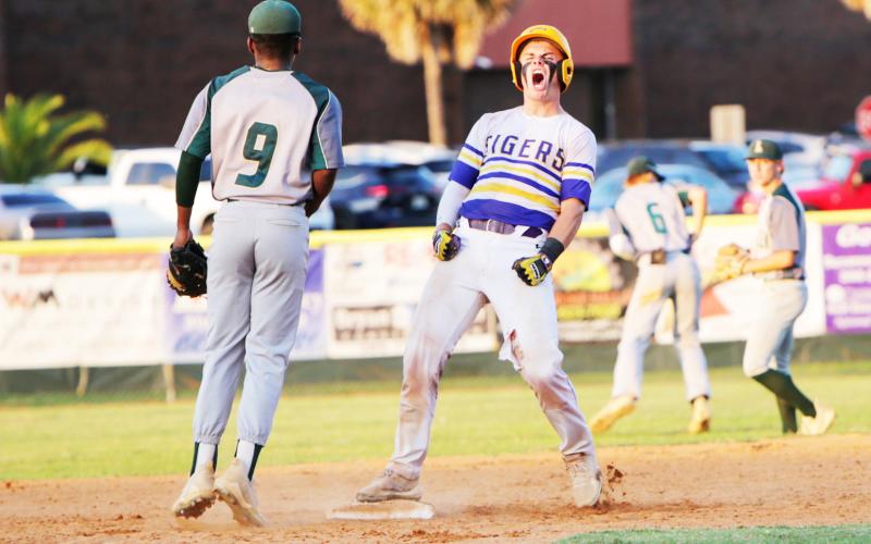 Columbia catcher Hayden Gustavson celebrates at second base after hitting a double against Lincoln  during last season’s Region 1-5A championship. (BRENT KUYKENDALL/Lake City Reporter)