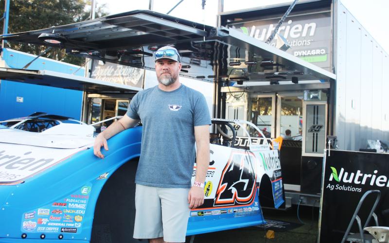Jonathan Davenport with his No. 49 car. (TONY BRITT/Lake City Reporter)