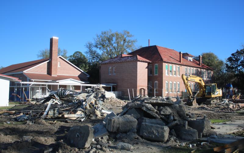 An excavator is pictured near ‘The Fort’ on the Fort White Elementary School campus on Monday afternoon. (TONY BRITT/Lake City Reporter)