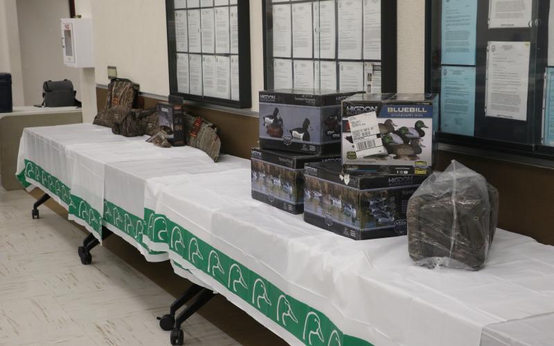 The Suwannee River Chapter of Ducks Unlimited set up raffle prizes ahead of Friday's annual banquet. (MORGAN MCMULLEN/Lake City Reporter)