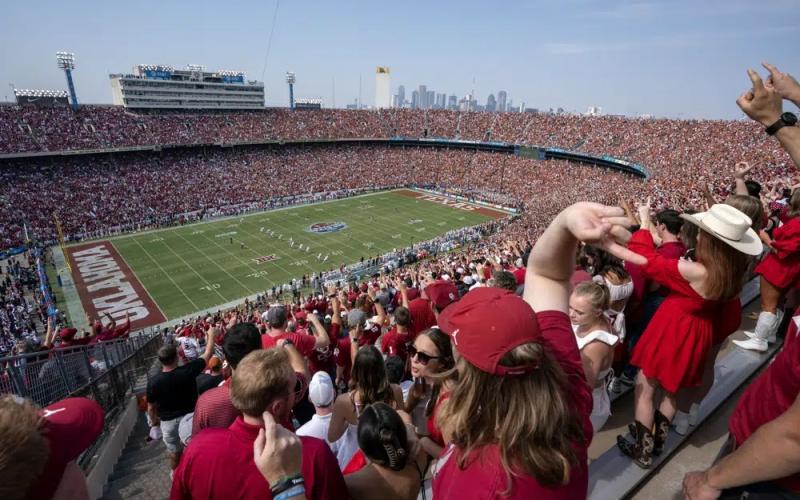 Oklahoma and Texas fans cheer at the Cotton Bowl on Oct. 8, 2022, in Dallas. (JEFFREY MCWHORTER/Associated Press)