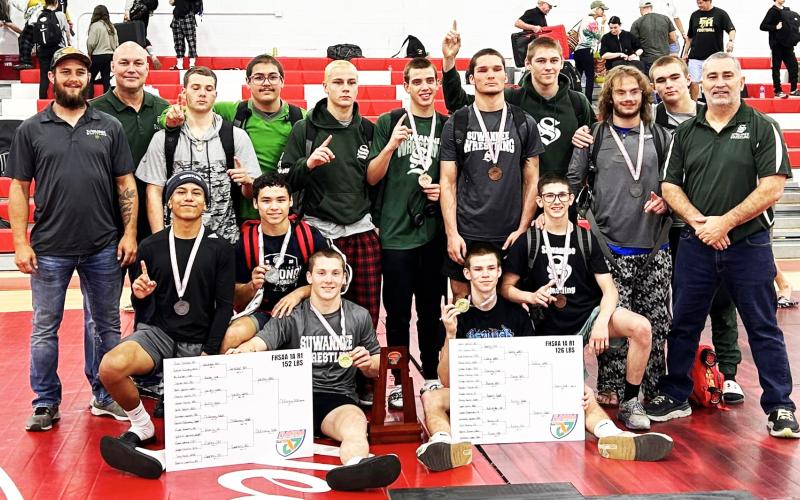Suwannee’s wrestling team celebrates after winning the Region 1-1A IBT on Saturday. (COURTESY)